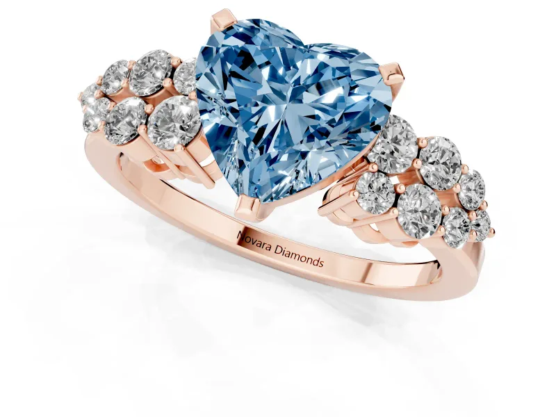 Fancy Blue Heart Cut Diamond Cluster Engagement Ring Set in Rose gold with Pavé Band and Prong Setting