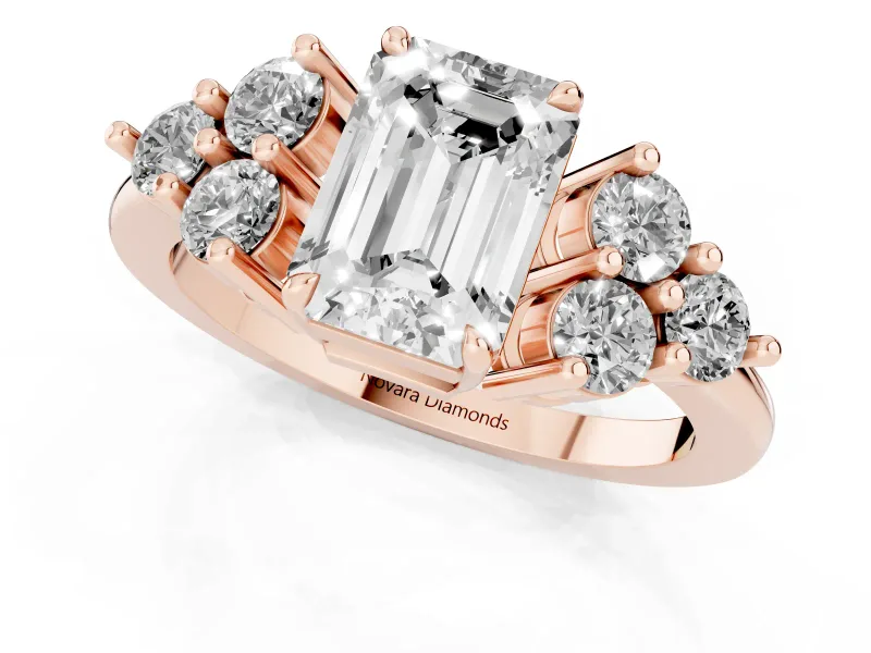 Emerald Cut Diamond Solitaire Ring Set in Rose gold with Cluster Accents on Each Side