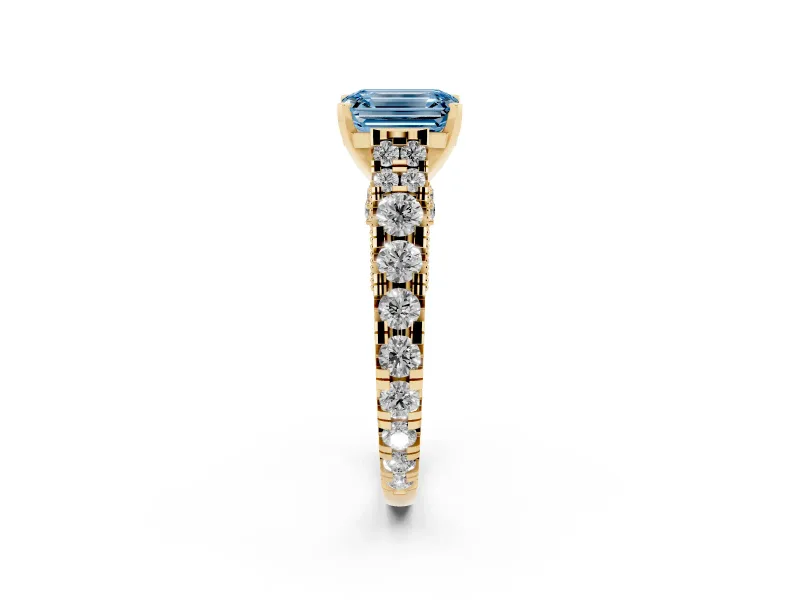 Fancy Blue Emerald Cut Diamond Classic Solitaire Ring Set in Yellow gold with Pavé Band and Prong Setting
