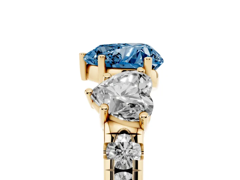 Fancy Blue Heart Cut Diamond Three-Stone Ring Set in Yellow gold with Pavé Band