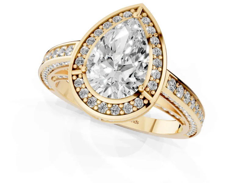 Pear Cut Diamond Halo Pavé Split Shank Ring Set in Yellow gold with Prong Setting