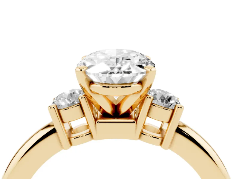 Three-Stone Oval Cut Diamond Ring Set in Yellow gold with Prong Setting and Plain Band