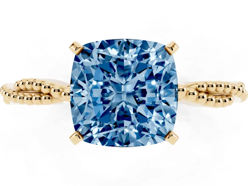 Fancy Blue Cushion Cut Diamond Solitaire Ring Set in Yellow gold with Twisted Band and Bead Prong Setting