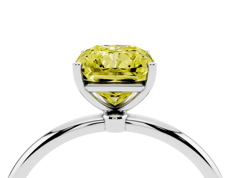 Fancy Yellow Radiant Cut Diamond Solitaire Engagement Ring Set in White gold with Thin Band and Prong Setting