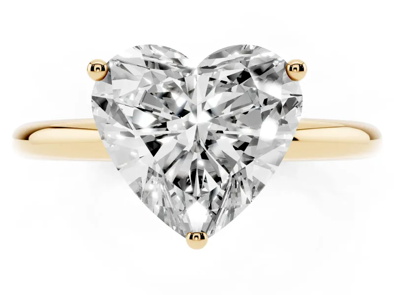 Heart Cut Diamond Solitaire Engagement Ring Set in Yellow gold with Prong Setting and Polished Band