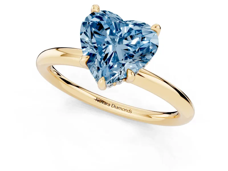 Fancy Blue Heart Cut Diamond Solitaire Ring Set in Yellow gold with Thin Band and Prong Setting