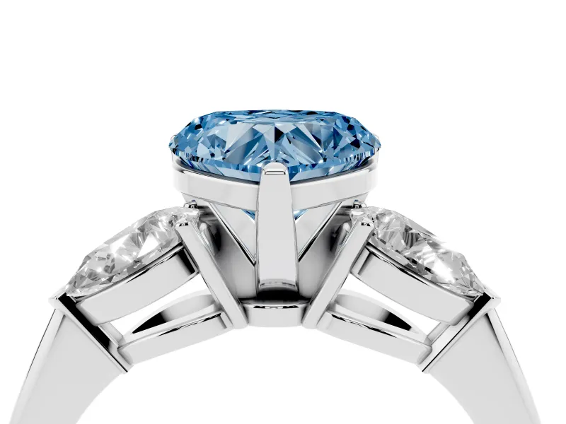 Fancy Blue Three-Stone Heart Cut Diamond Ring Set in Platinum with Pear Side Stones and Prong Setting