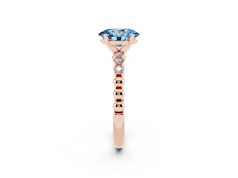 Fancy Blue Oval Cut Diamond Solitaire Engagement Ring Set in Rose gold with Bezel Accents on Beaded Band