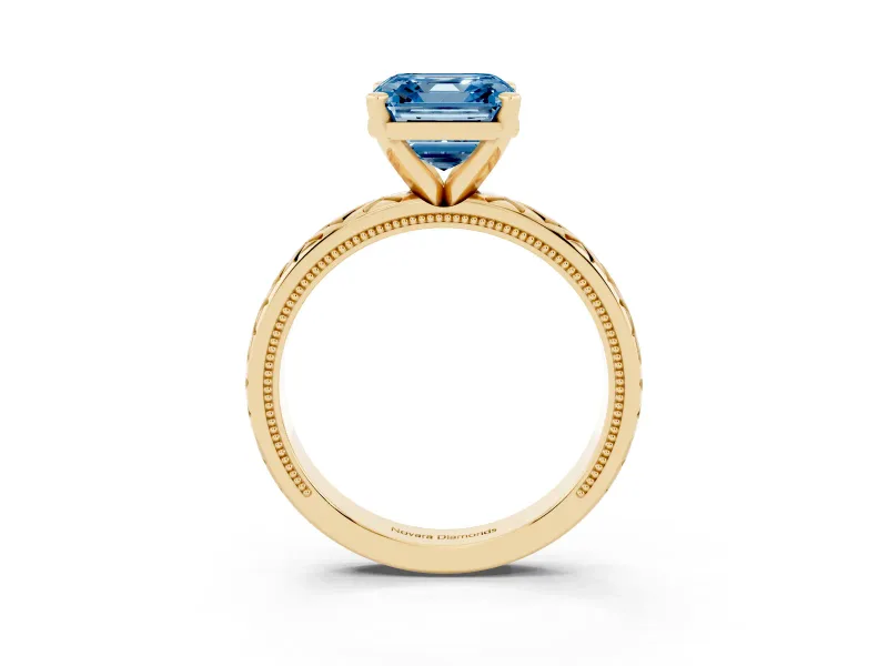 Fancy Blue Asscher Cut Diamond Solitaire Ring Set in Yellow gold with Milgrain and Black Enamel X Pattern Band