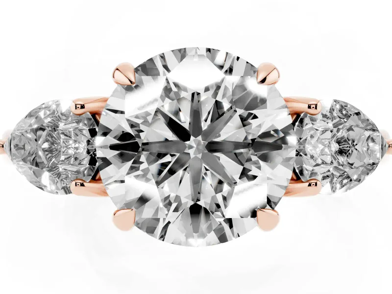 Round Cut Diamond Three-Stone Ring Set in Rose gold with Pear Side Stones