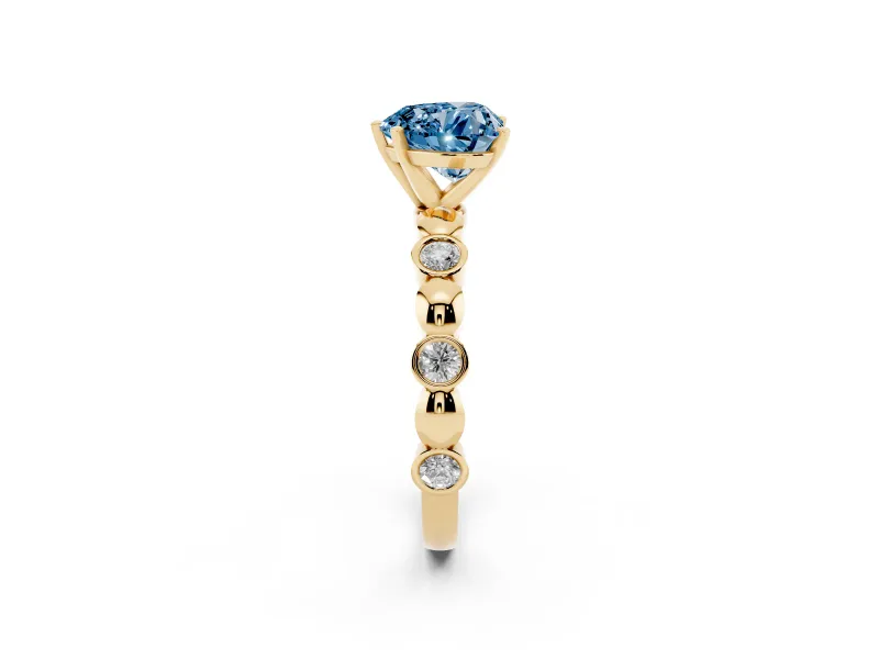 Fancy Blue Heart Cut Diamond Solitaire Ring Set in Yellow gold with Bezel-Set Accents on Beaded Band and Prong Setting