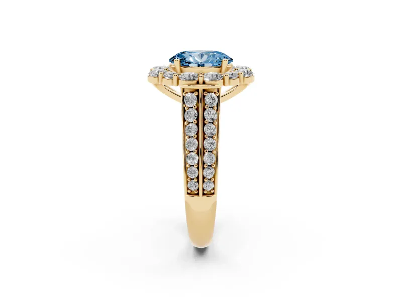 Fancy Blue Oval Cut Diamond Halo Engagement Ring Set in Yellow gold with Split Shank and Prong Setting