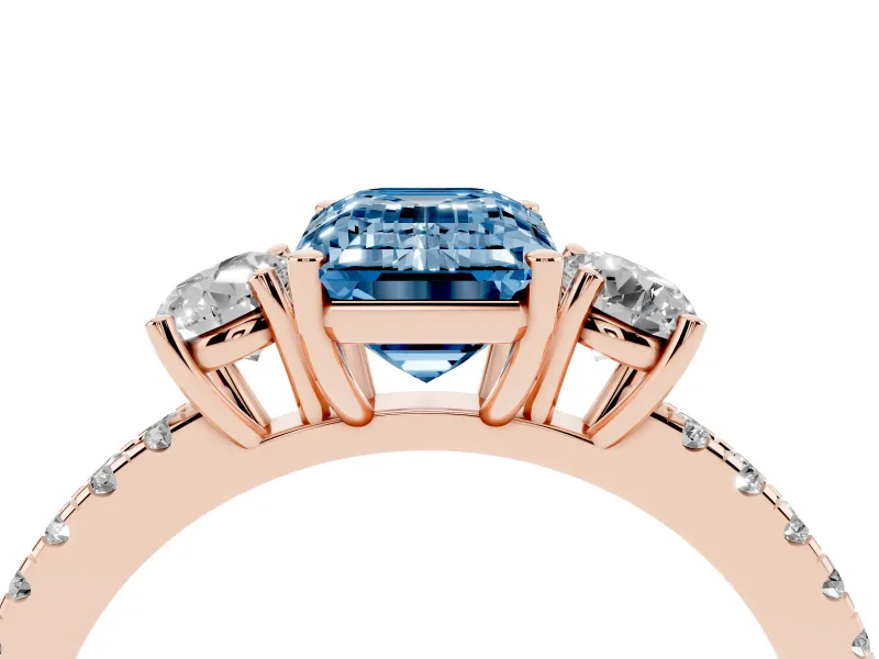 Emerald Cut Three Stone Engagement Ring Setting for a Fancy Blue Lab-Grown Diamond | Pave Shoulders | Rose Gold