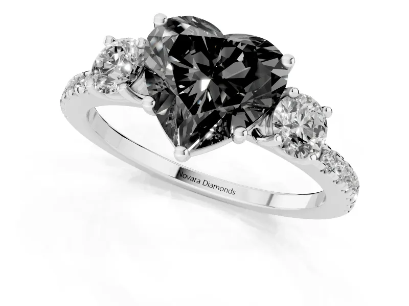 Fancy Black Heart Cut Diamond Three-Stone Ring Set in Platinum with Pavé Band and Graduated Sides