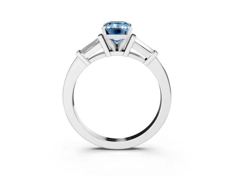 Fancy Blue Emerald Cut Diamond Solitaire Ring Set in White gold with Tapered Baguette Accents and Prong Setting