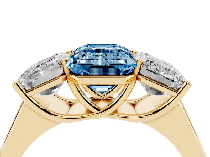 Emerald Cut Three Stone Engagement Ring Setting for a Fancy Blue Lab-Grown Diamond | Basket Prong Heads | Yellow Gold