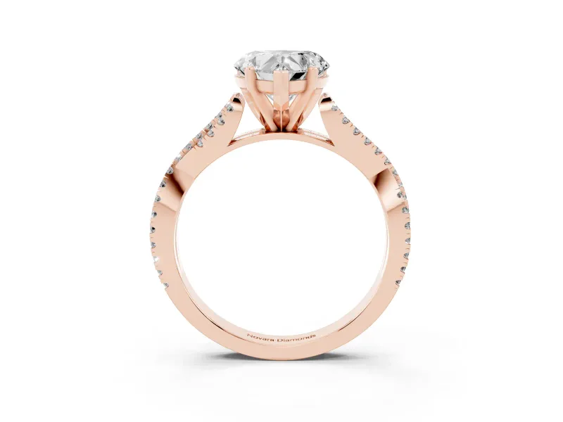 Heart Cut Diamond Solitaire Engagement Ring Set in Rose gold with Twisted Pavé Band and Prong Setting