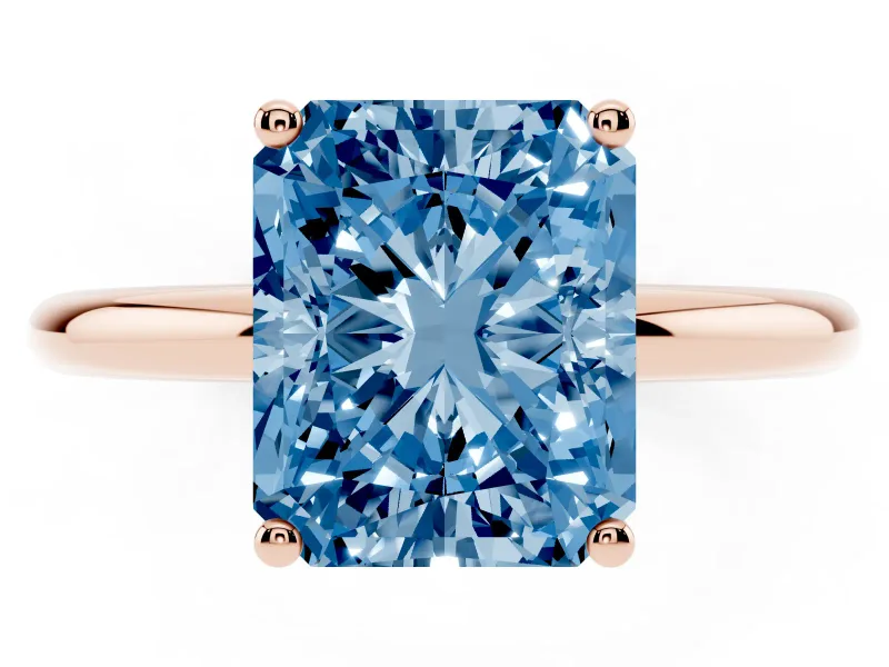 Fancy Blue Radiant Cut Diamond Solitaire Engagement Ring Set in Rose gold with Prong Setting and Polished Band