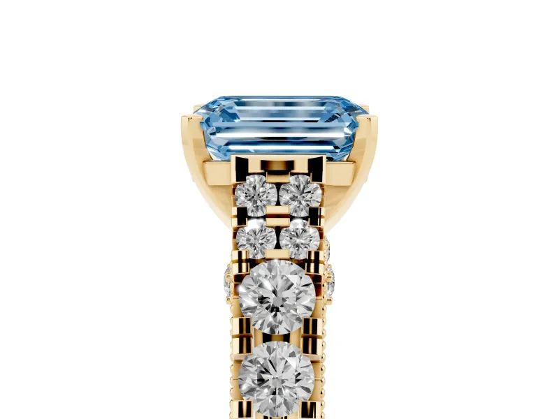 Fancy Blue Emerald Cut Diamond Classic Solitaire Ring Set in Yellow gold with Pavé Band and Prong Setting