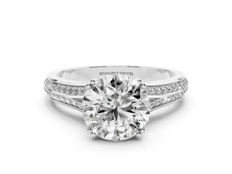 Round Cut Diamond Split Shank Pavé Engagement Ring Set in Platinum with Prong-Set Center Stone
