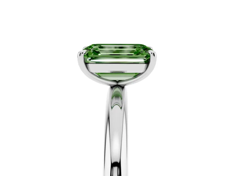 Fancy Green Emerald Cut Diamond Solitaire Ring Set in White gold with Prong Setting on a Polished Plain Band