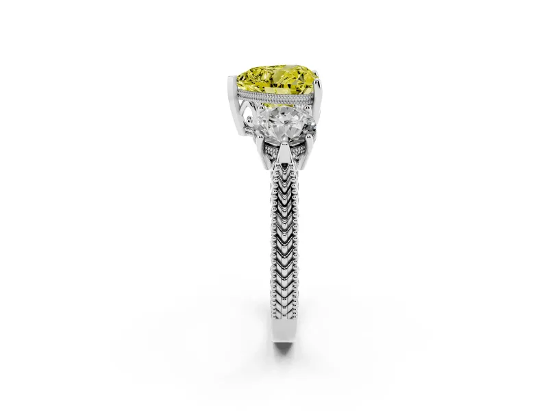Fancy Yellow Heart Cut Diamond Three-Stone Ring Set in White gold with Milgrain Band