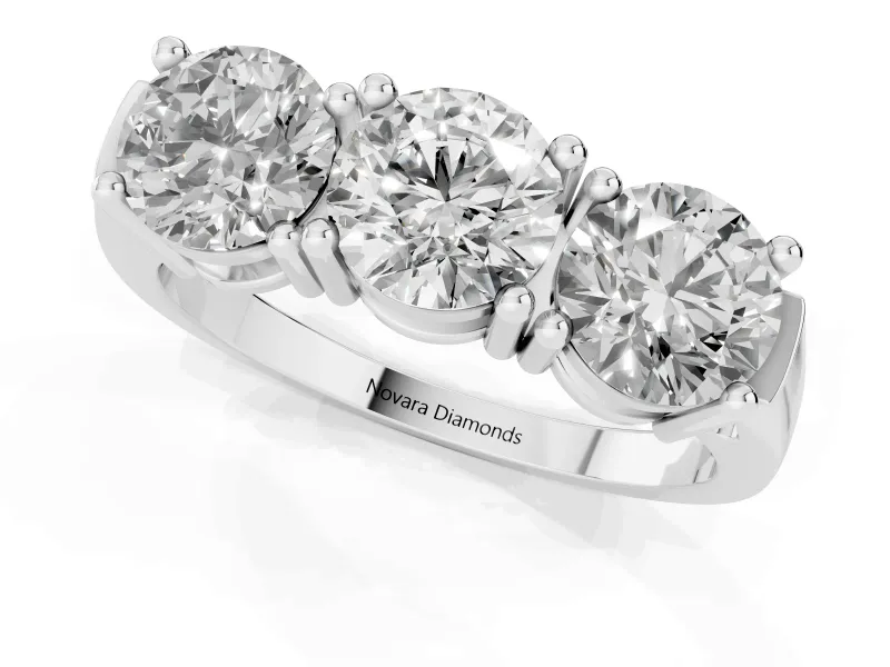 Round Cut Diamond Three-Stone Ring Set in Silver with Channel Band and Sturdy Prongs