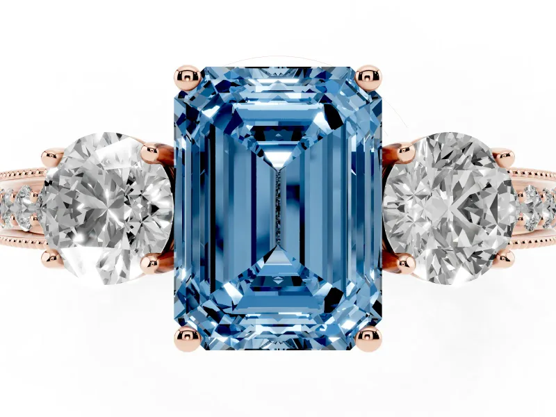 Fancy Blue Emerald Cut Diamond Three-Stone Ring Set in Rose gold with Round Side Stones and Pavé Band