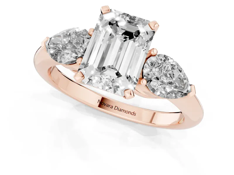 Three-Stone Emerald Cut Diamond Ring Set in Rose gold with Pear Side Stones and Prong Setting