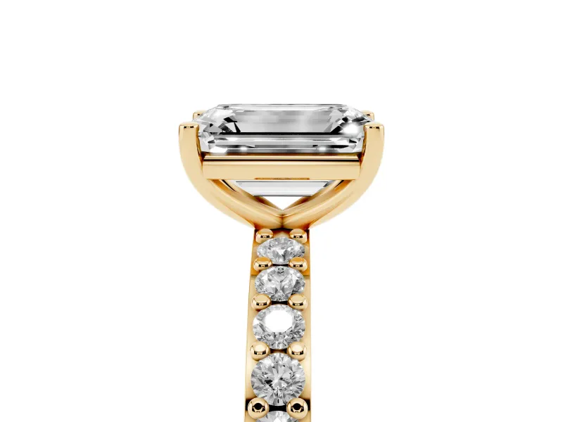 Emerald Cut Diamond Solitaire Set in Yellow gold with Round Pavé Band and Prong Setting