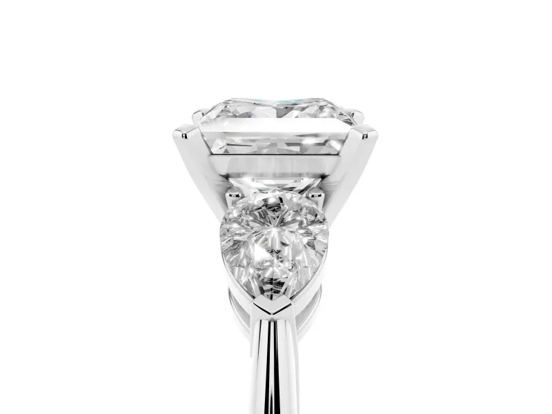 Three-Stone Princess Cut Diamond Ring Set in White gold with Pear Side Stones and Prong Setting