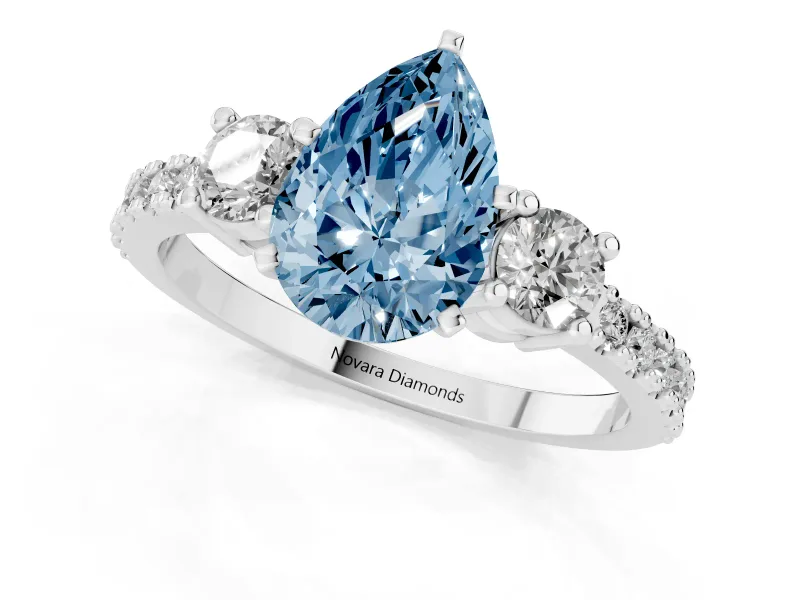 Fancy Blue Three-Stone Pear Cut Diamond Pavé Band Ring Set in White gold with Prong Setting