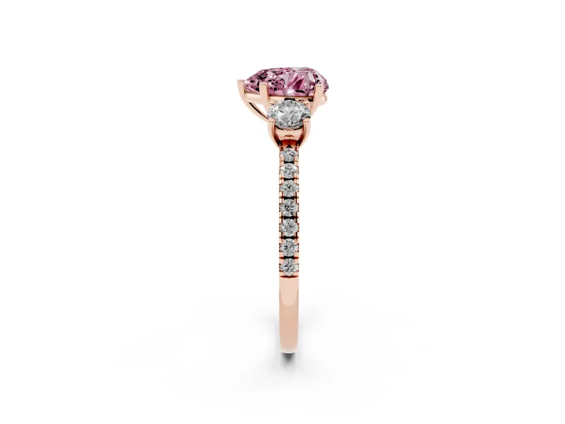Fancy Pink Heart Cut Diamond Three-Stone Ring Set in Rose gold with Pavé Band and Graduated Sides