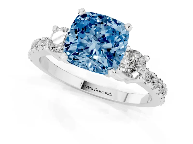 Fancy Blue Three-Stone Cushion Cut Diamond Pavé Band Ring Set in Platinum with Prong Setting