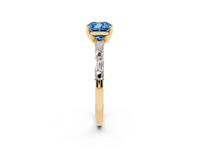 Fancy Blue Cushion Cut Diamond Solitaire Set in Yellow gold with Side Baguettes and Channel Set Band