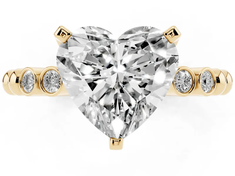 Heart Cut Diamond Solitaire Engagement Ring Set in Yellow gold with Bezel Accents on Beaded Band