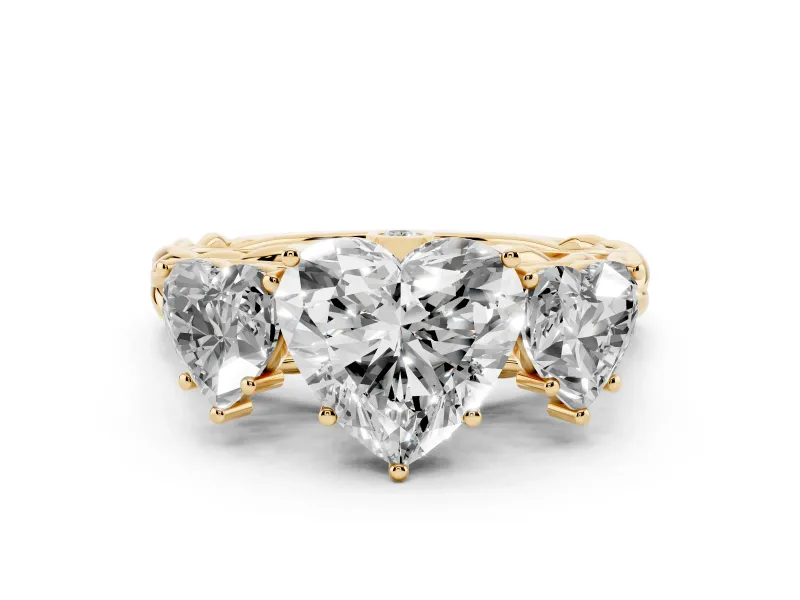 Heart Cut Diamond Three-Stone Ring Set in Yellow gold with Braided Band