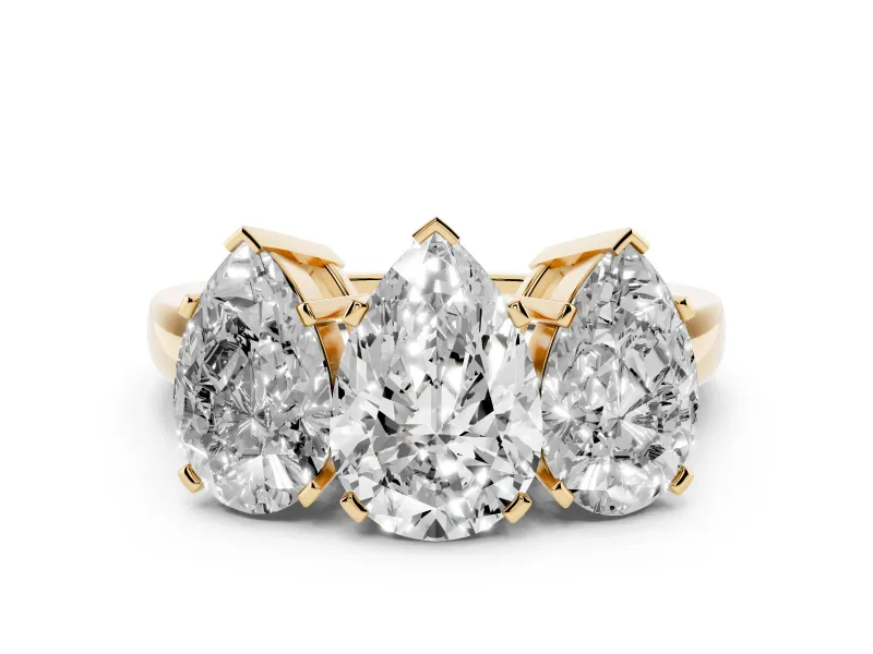 Pear Cut Diamond Three-Stone Ring Set in Yellow gold with Channel-Set Band and Prong Settings