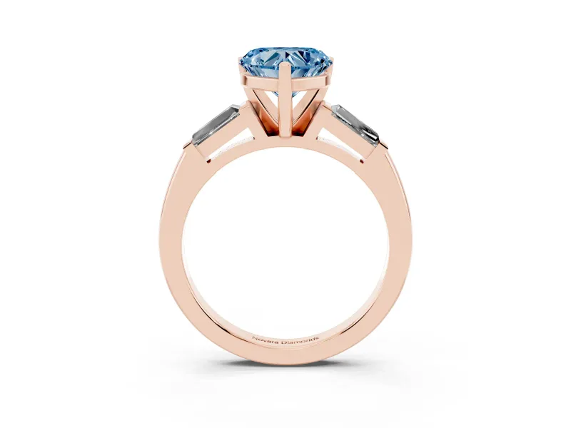 Fancy Blue Heart Cut Diamond Solitaire Ring Set in Rose gold with Tapered Baguette Side Stones and Prong Setting
