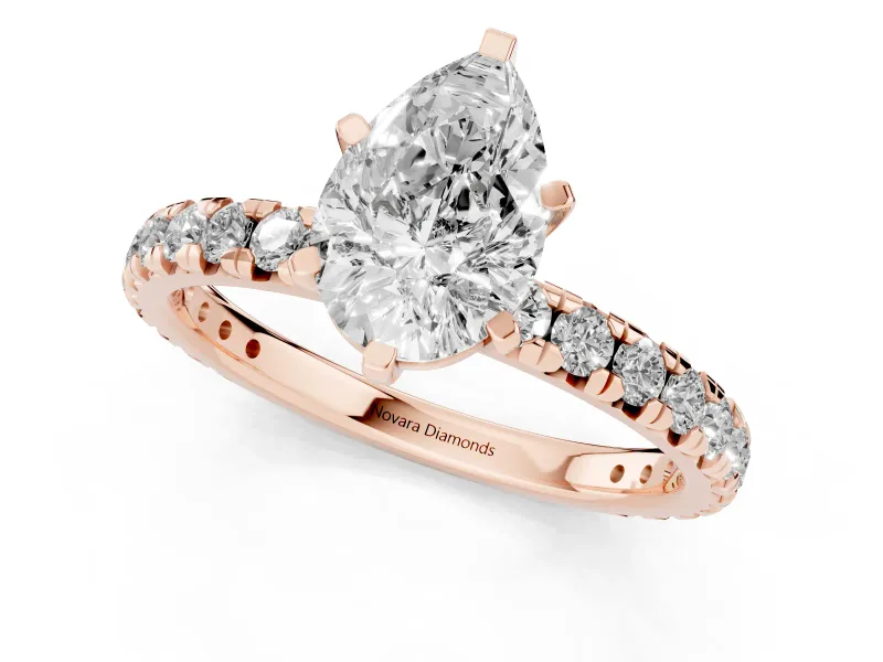Pear Cut Diamond Pavé Solitaire Ring Set in Rose gold with Round Band and Prong Setting