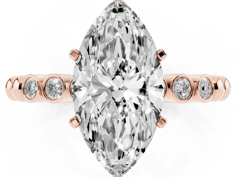 Marquise Cut Diamond Solitaire Engagement Ring Set in Rose gold with Bezel Accents on Beaded Band