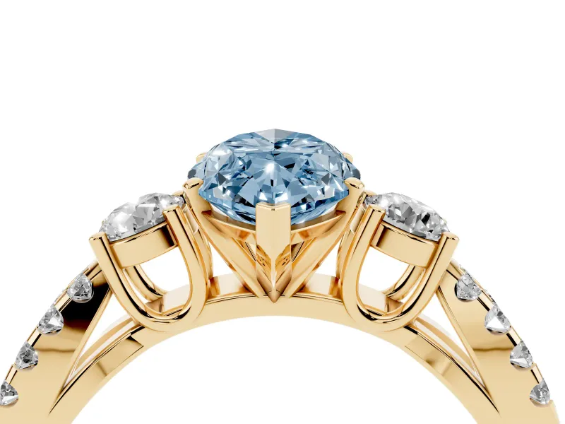 Fancy Blue Marquise Cut Diamond Three-Stone Ring Set in Yellow gold with Pavé Split Shank and Prong Setting