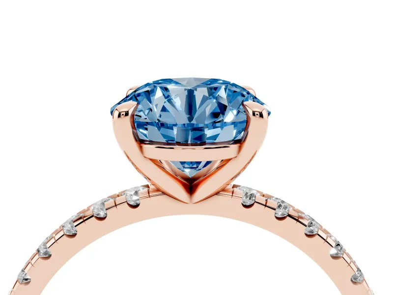 Fancy Blue Round Cut Diamond Brilliant Solitaire Ring Set in Rose gold with Pavé Band and Prong Setting