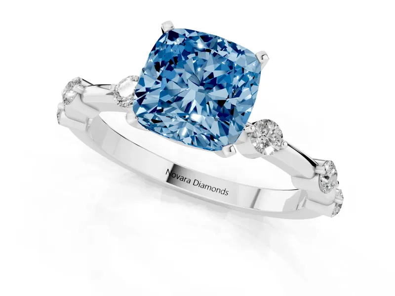 Fancy Blue Cushion Cut Diamond Solitaire Ring Set in Platinum with Bezel Set Side Stones and Prong Setting
