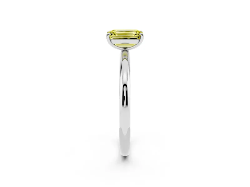 Fancy Yellow Emerald Cut Diamond Solitaire Ring Set in Platinum with Prong Setting on a Polished Plain Band