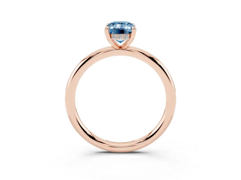 Fancy Blue Emerald Cut Diamond Solitaire Ring Set in Rose gold with Thin Band and Prong Setting