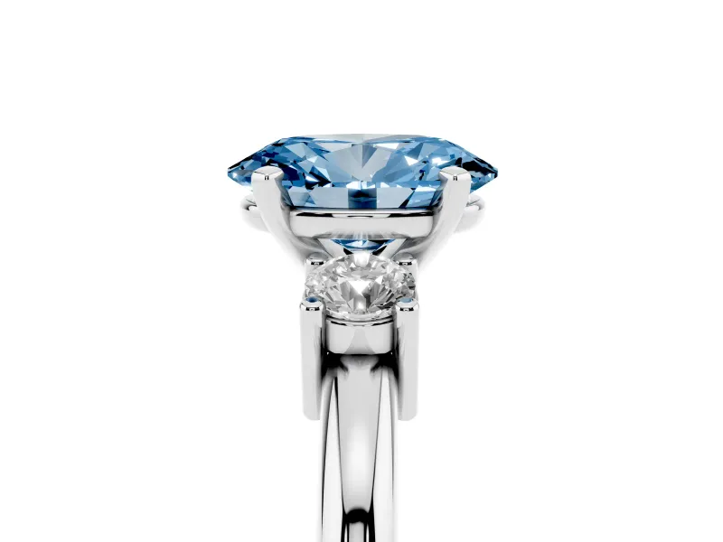 Fancy Blue Three-Stone Oval Cut Diamond Ring Set in Platinum with Prong Setting and Plain Band
