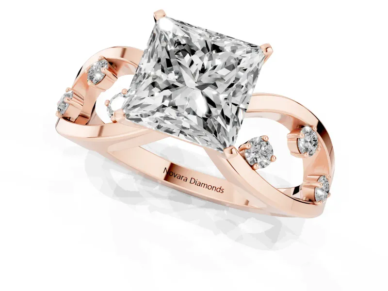 Princess Cut Diamond Solitaire Ring Set in Rose gold with Side Stones on Criss-Cross Band and Prong Setting