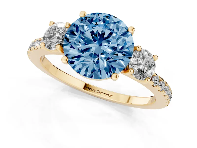 Fancy Blue Round Cut Diamond Three-Stone Ring Set in Yellow gold with Pavé Band and Graduated Sides