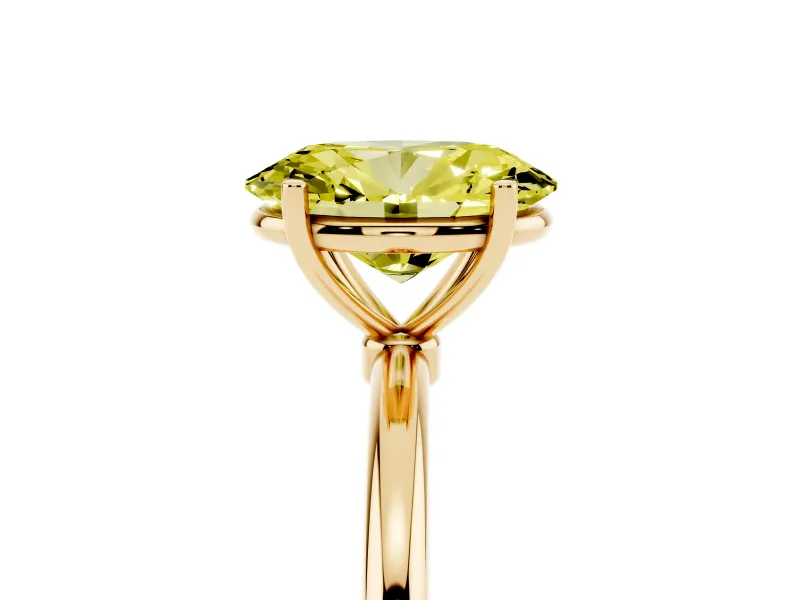 Fancy Yellow Oval Cut Diamond Solitaire Engagement Ring Set in Yellow gold with Thin Band and Prong Setting